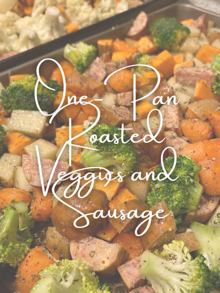 Title of blog. One Pan Roasted Veggies and Sausage. Background: sheet pan with broccoli, sweet potatoes, sausage, carrots and seasoning. 